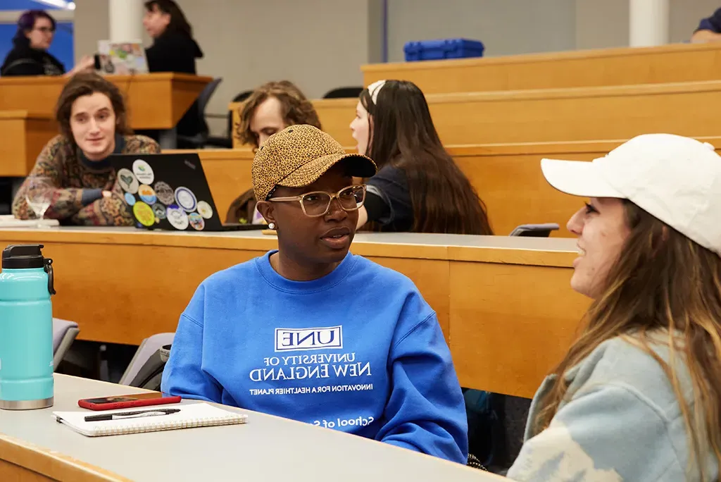 Students talking at an Environmental Council meeting